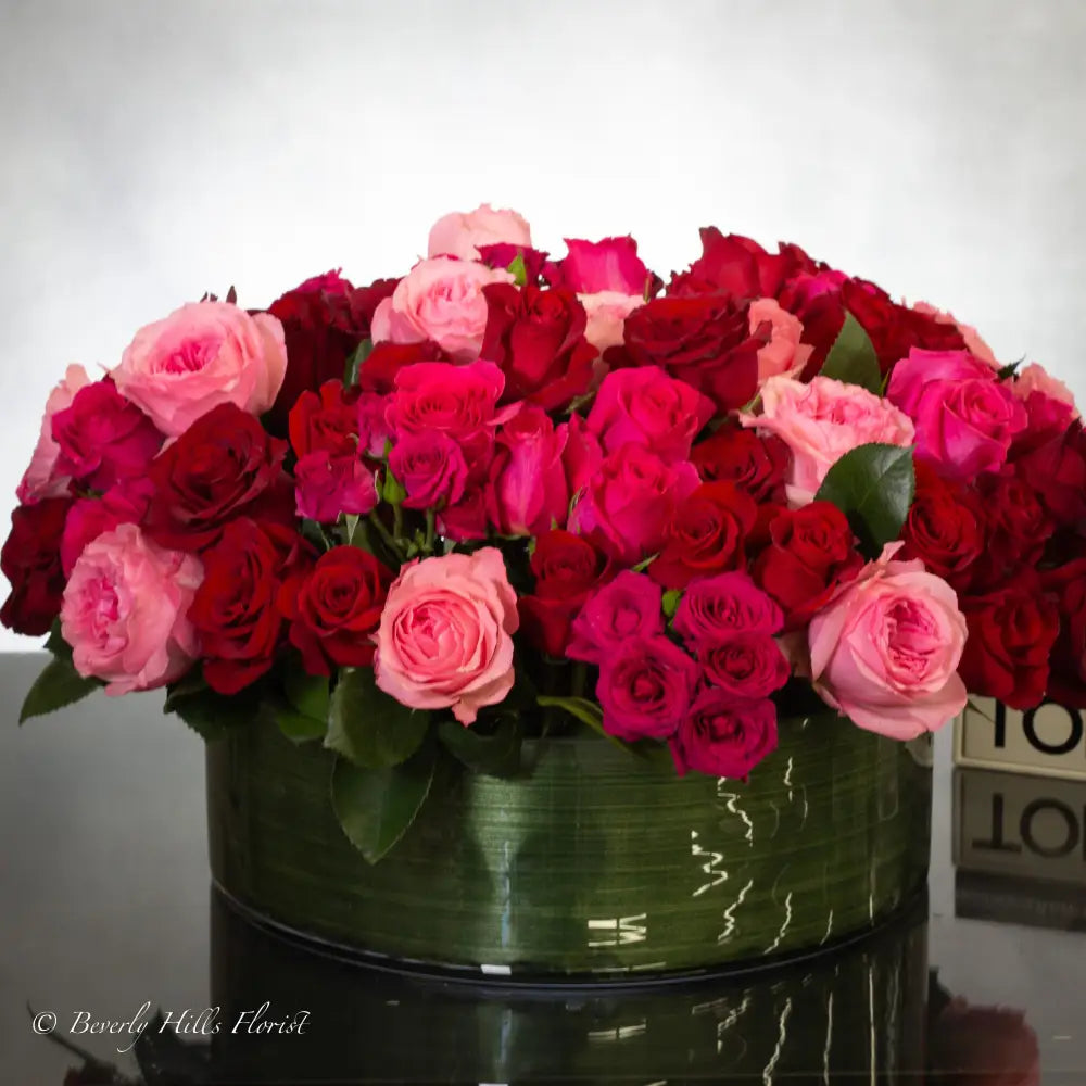 100 Blooms of Love in a glass vase with white, pink, and red fresh flowers, same-day delivery by LA Orchidia.